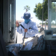 A USPS postal worker wears a face mask amid the COVID-19 pandemic in hard-hit Imperial County on July 21, 2020, in El Centro, California. Imperial County currently suffers from the highest death rate and near-highest infection rate from COVID-19 in California.